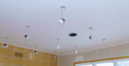 Downlights being installed in a living room