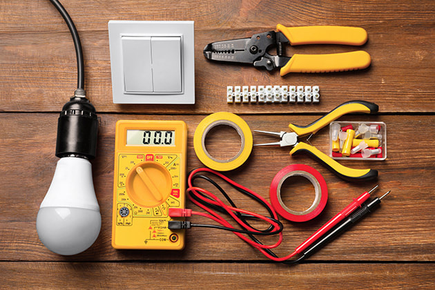 Electrical tools neatly laid out on a table birds eye view photo